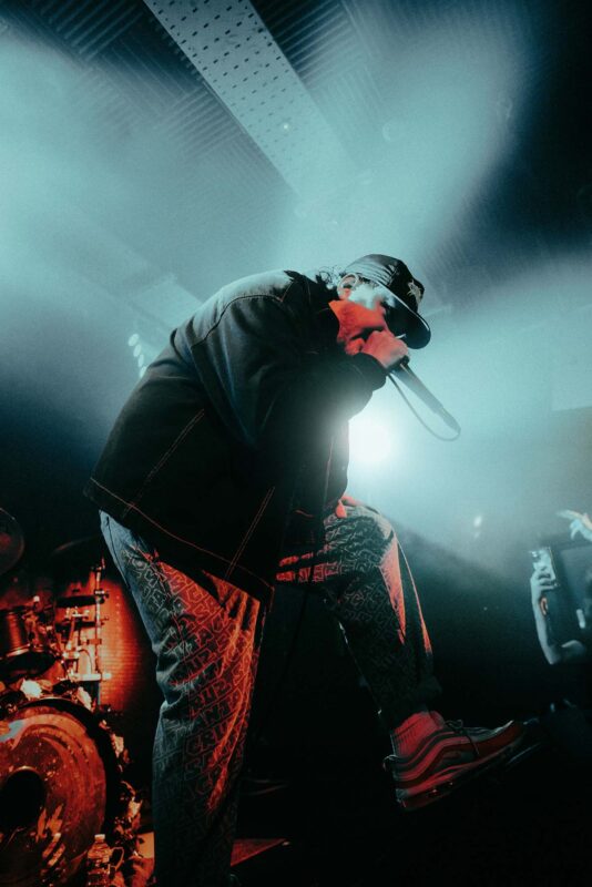 Philip Cross singer of metalcore band Continents singing on stage in London.