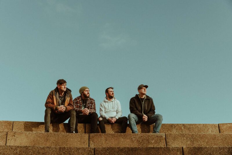 Swansea based rock band Traversed sat at the top of a set of concrete stairs, staring into the evening light. Shot as part of a promo press shoot.